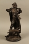 Bronze figurine of a Jewish man holding a rooster