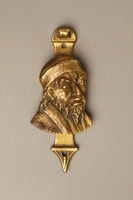 2016.184.14 front
Brass door knocker with the head of an evil looking Shylock

Click to enlarge