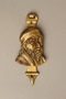 Brass door knocker with the head of an evil looking Shylock