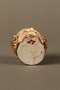 Porcelain drinking cup shaped as the head of a sneering Jewish man