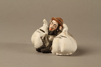 2016.184.31 left side
Bisque coin bank in the shape of a Jew with a garlic bulb under each arm

Click to enlarge