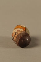 2016.184.36 top
Bottle stopper with a wooden finial depicting a Jewish stereotype

Click to enlarge