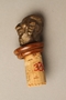 Cork bottle stopper with a bronze finial depicting a Jewish stereotype