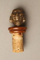 2016.184.37 front
Cork bottle stopper with a bronze finial depicting a Jewish stereotype

Click to enlarge