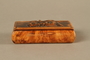 Wood snuff box with a carving of three Jewish hareskin dealers