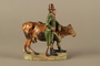 Terracotta figurine of a Jewish peddler with an underfed cow