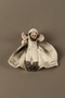 Bisque figurine of a Jew in a white plasterer’s coat and gray boots