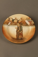 2016.184.69 front
Royal Doulton Dickens Ware dinner plate decorated with an image of Fagin

Click to enlarge