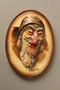Painted ceramic wall plaque of a grinning Fagin