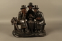 Hand painted metal figure group of 3 Jews on a bench with their umbrellas