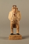 Carved wooden figure of a Jewish doctor in white coat and head mirror