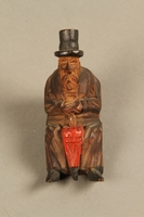 2016.184.110_d  front
Tobacco pipe with decorative wooden stand of three Jews on a bench

Click to enlarge