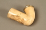 Meerschaum pipe bowl with a carved image of a Jewish man holding a pig