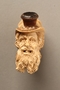 Ivory cigarette holder carved as the head of a bearded Jew