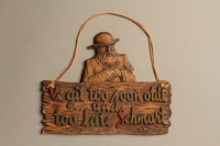 2016.184.138  front
Wooden plaque of a Jew and a sign with a folk saying

Click to enlarge