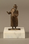 Bronze figurine of a male Jewish matchmaker with an umbrella at his side