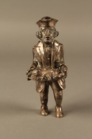 2016.184.569 front
Metal figurine of a Jewish man carrying a tray with a suckling piglet

Click to enlarge