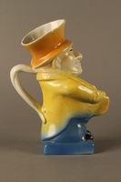 2016.184.590 right side
Ceramic jug shaped as a comical Jewish man with a collection box

Click to enlarge