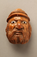 2016.184.597 front
Coquilla nut snuff box carved in the shape of an angry looking Jewish man

Click to enlarge