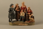 Colorful terracotta figure group of a Jewish family dressed for Sabbath