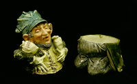 Ceramic cookie jar of a Jewish man kneeling with 2 money bags

Click to enlarge