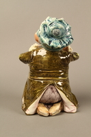 2016.184.620_a-b back
Ceramic cookie jar of a Jewish man kneeling with 2 money bags

Click to enlarge