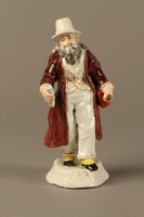 2016.184.625 front
White porcelain figurine of a Jewish money changer in a gold striped vest

Click to enlarge