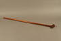 Wooden cane with a carved grip of a bearded Jewish peddler in a cap
