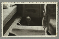 2016.184.789 front
Postcard photo of a man showing his wartime hiding place

Click to enlarge