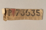 Cloth patch with a red triangle and number 73635