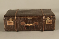 2016.112.8 front
Large suitcase with a broken handle used by a young Austrian Jewish refugee during emigration

Click to enlarge