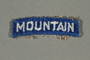 10th Mountain Division tab worn above the divison's uniform patch