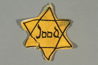 2016.496.3 front
Factory-printed Star of David badge printed with Jood worn by a Jewish person

Click to enlarge