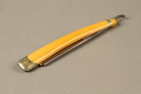 2017.263.3 front
Straight razor with yellow plastic handle

Click to enlarge