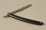 Straight razor with black plastic handle