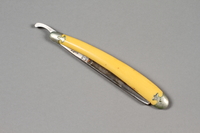 2017.263.6 a side b
Straight razor with yellow plastic handle

Click to enlarge