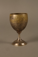 2017.356.1 left side
Kiddush cup engraved with a Hebrew prayer owned by a Romanian Jewish family

Click to enlarge