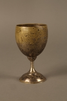 2017.356.1 right side
Kiddush cup engraved with a Hebrew prayer owned by a Romanian Jewish family

Click to enlarge