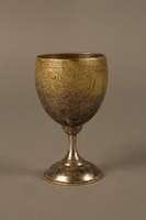 2017.356.1 back
Kiddush cup engraved with a Hebrew prayer owned by a Romanian Jewish family

Click to enlarge