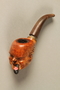 Tobacco pipe with a bowl carved into the shape of Churchill’s head
