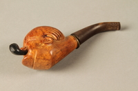 2017.541.8 bottom
Tobacco pipe with a bowl carved into the shape of Churchill’s head

Click to enlarge