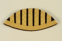 1992.127.7 front
Epaulet with yellow swastikas and black stripes found by a US soldier

Click to enlarge