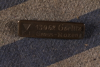 1992.161.1.2 front
Identification pin attached to piece of concentration camp uniform

Click to enlarge