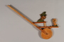 Wooden wheel punching toy with Hitler as target