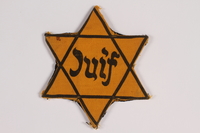 2014.476.2 front
Star of David badge with Juif printed in the center

Click to enlarge