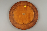 2018.276.1 back
Wooden Lazy Susan decorated with an inlaid windmill scene created by a Latvian in a displaced persons camp

Click to enlarge