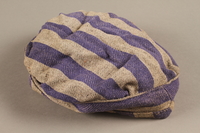 2014.557.5 side a
Concentration camp uniform cap worn by a Polish Jewish prisoner who was in several camps

Click to enlarge