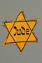 Factory-printed Star of David badge acquired by a Polish Jewish refugee and activist