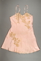 Pink chemise with corded, floral lace appliques owned by a Hungarian Jewish woman
