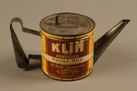 2018.426.10 a-b side a
Kettle made from a can of Klim powdered milk and used by an American internee

Click to enlarge